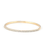 A close-up of a gold moissanite tennis bracelet, showcasing its radiant sparkle and timeless appeal against a neutral background.