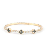 A luxury 14K gold bracelet with black onyx stones, designed with elegance and flexibility for an everyday chic style.