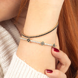 A stunning black onyx gold bracelet with flexible adjustability, perfect for layering or wearing alone.