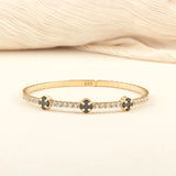 clovre gold bracelet featuring black onyx stones in a flexible, comfortable design for a timeless and sophisticated look.