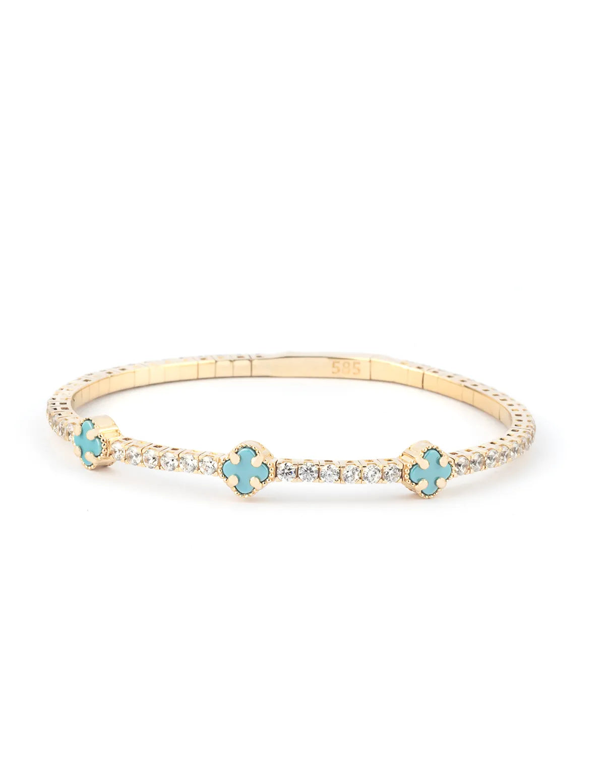 A stunning close-up of a turquoise crystal and 14K gold bracelet worn on a wrist, showcasing its refined elegance.