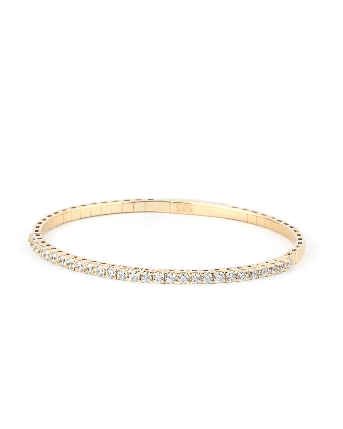  A close-up of a gold moissanite tennis bracelet, showcasing its radiant sparkle and timeless appeal against a neutral background.