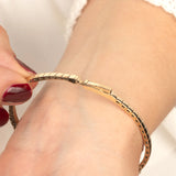  A detailed view of a gold moissanite tennis bracelet with a secure clasp, ensuring both beauty and functionality.