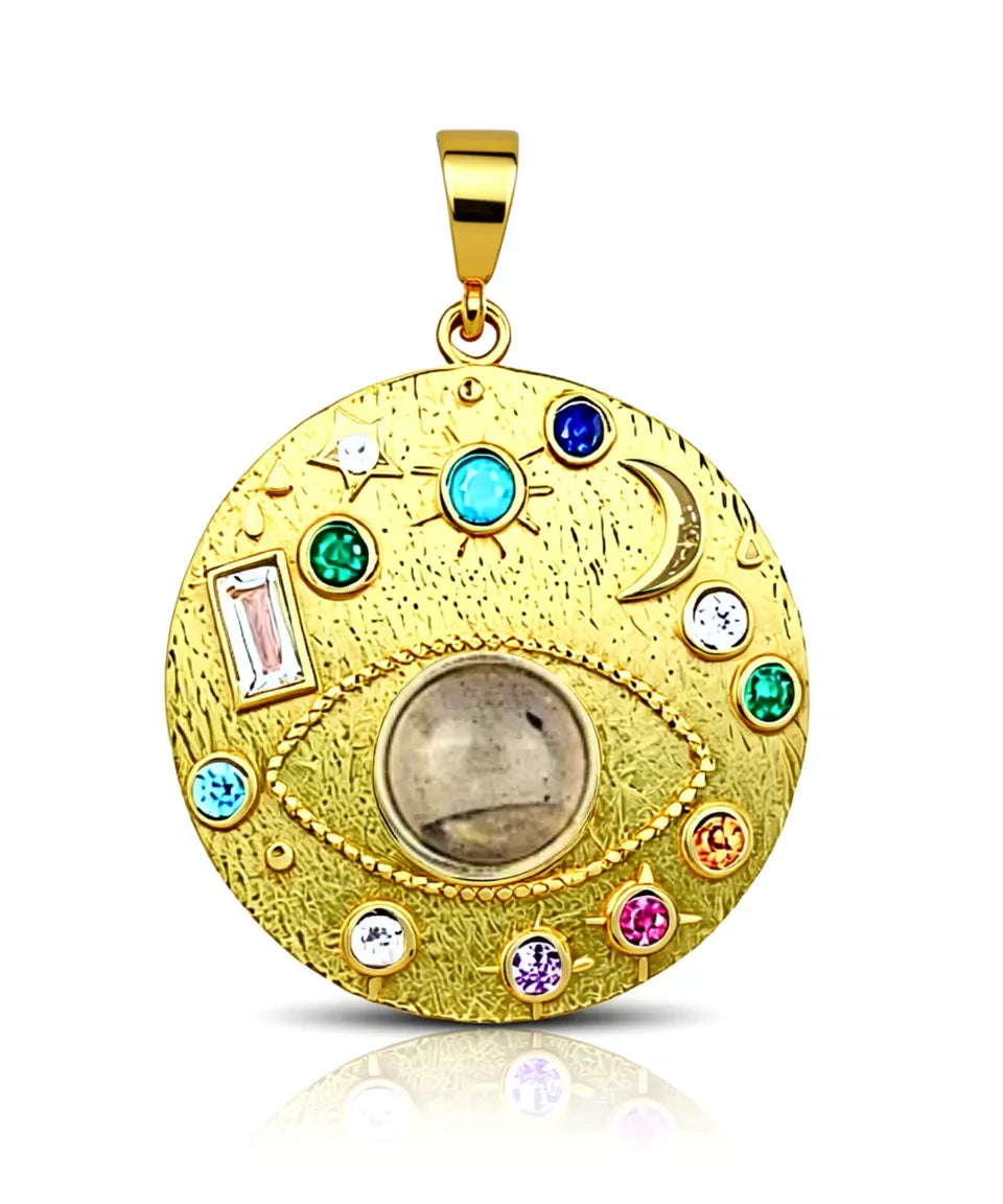 Gold pendant with colorful gemstones on a white background
