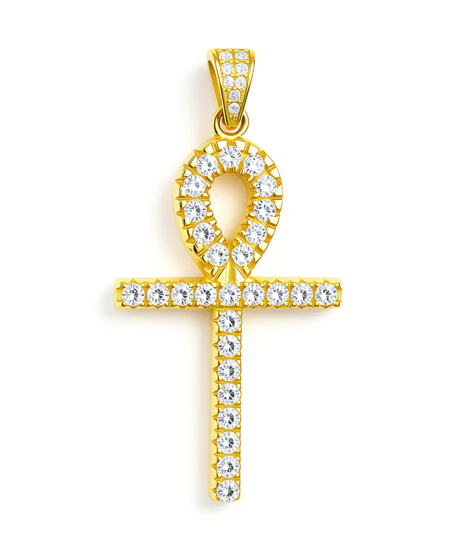 Gold pendant with a cross design and clear stones on a white background