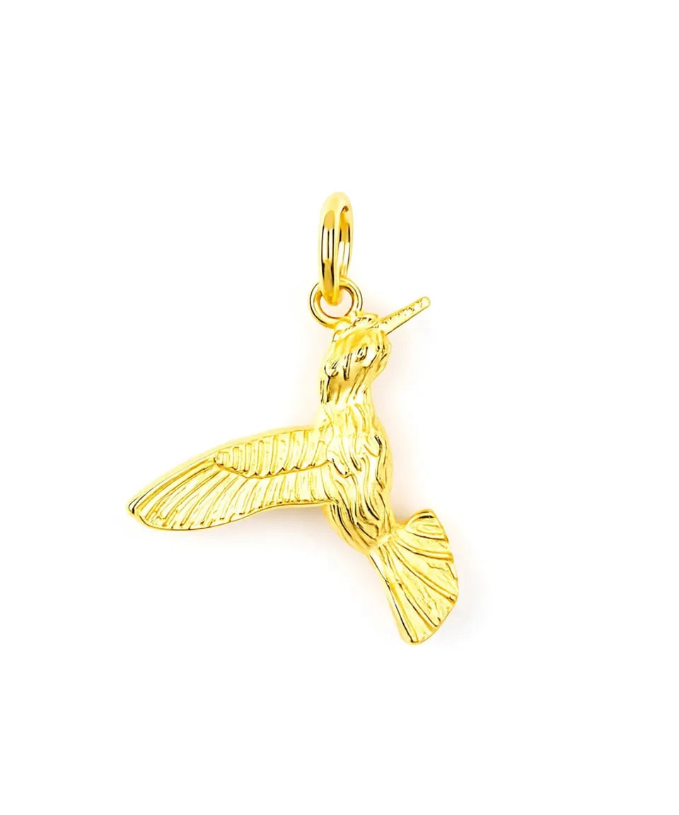 Gold hummingbird pendant on a white background