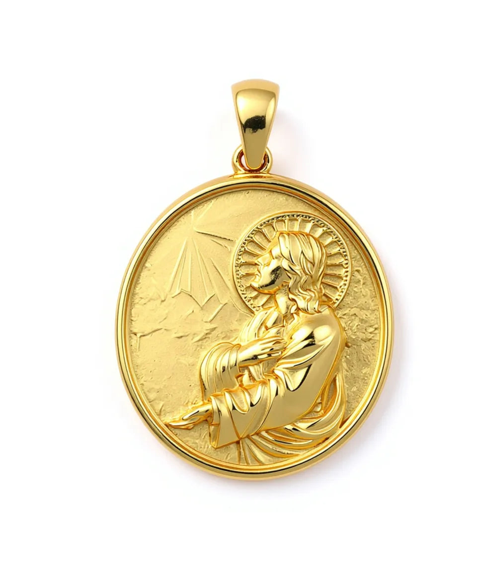 Gold pendant with a religious design on a white background