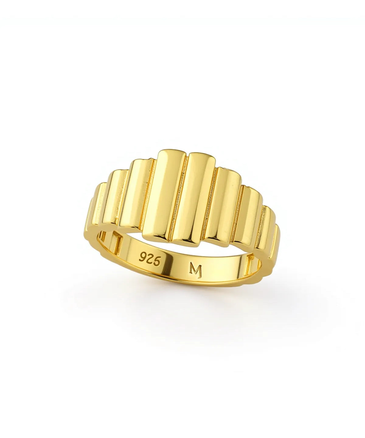 Gold ring with ribbed design on a white background