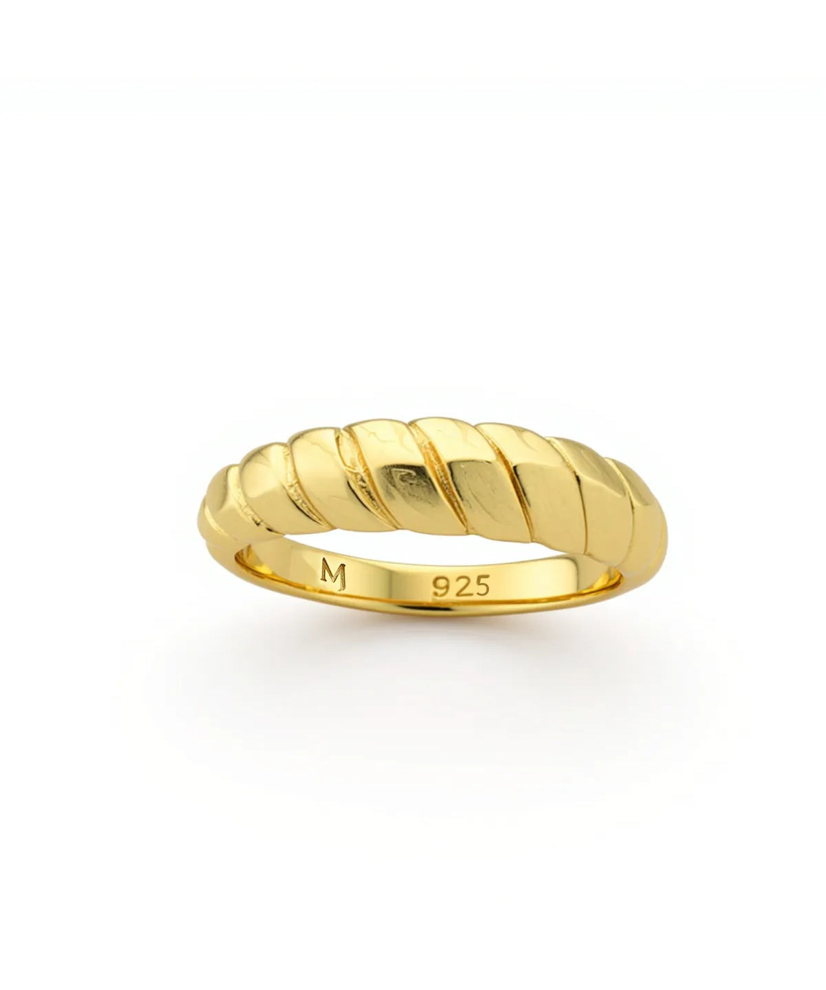 Gold ring with a textured design on a white background