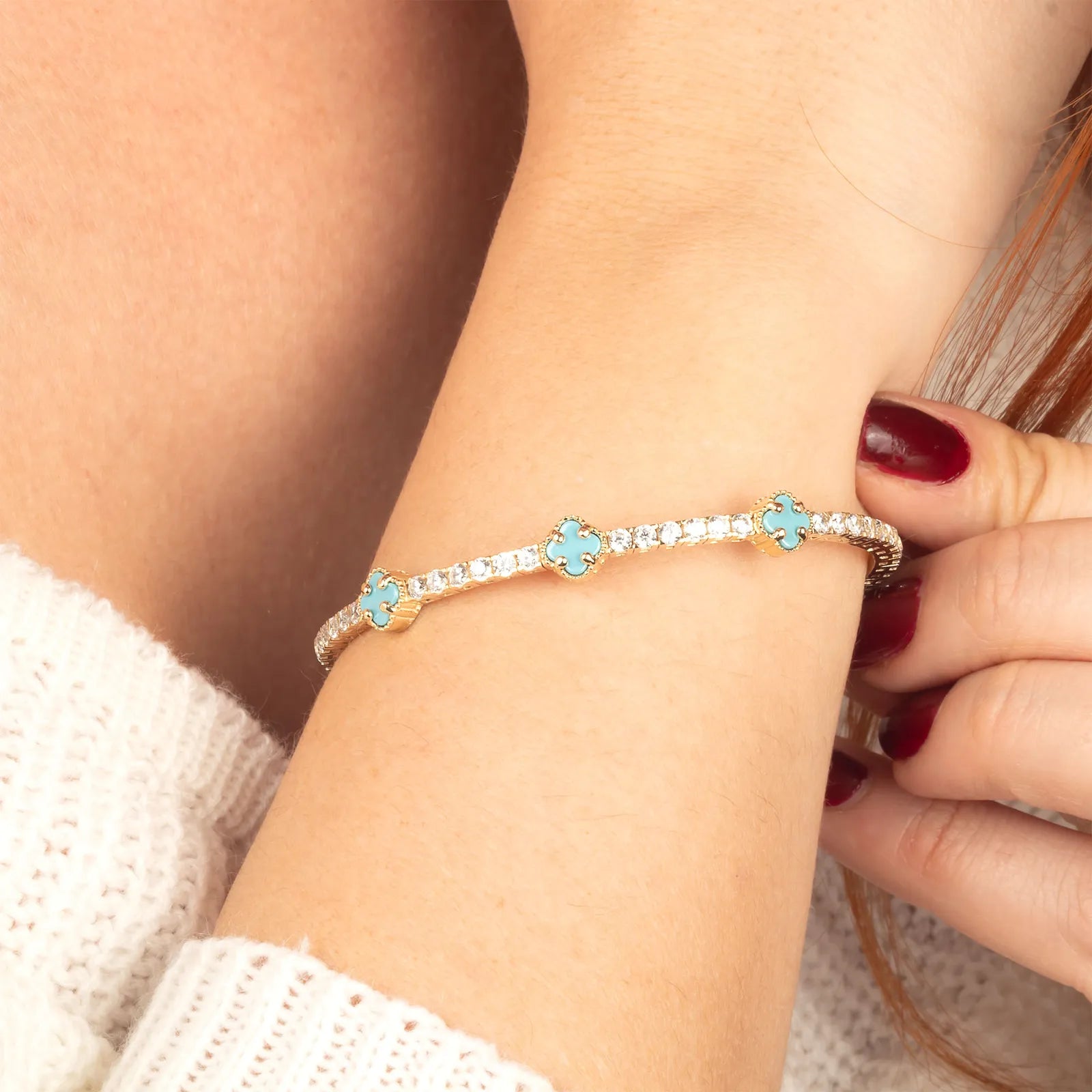 A timeless 14K gold bracelet with turquoise details, crafted for elegance and comfort.