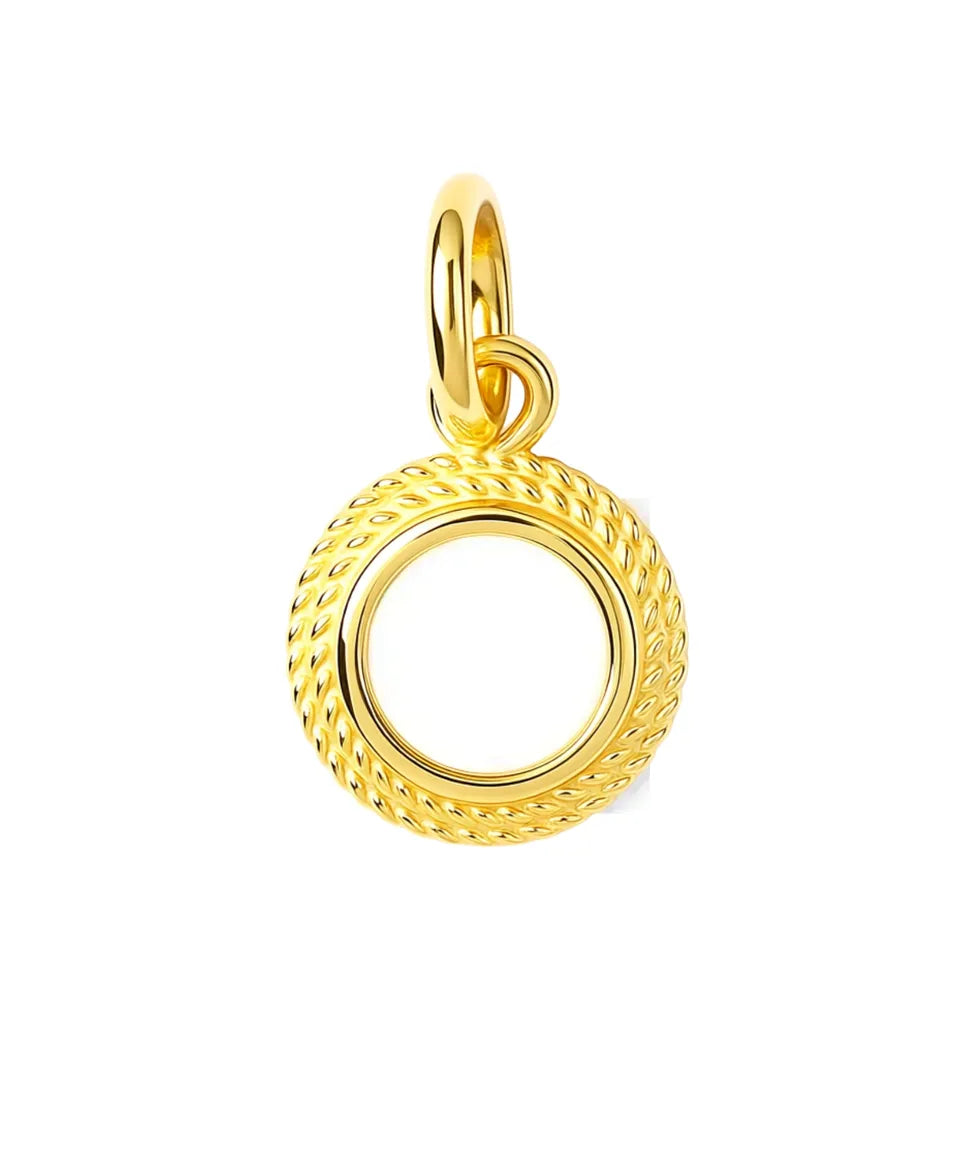 Gold pendant with textured design on a white background