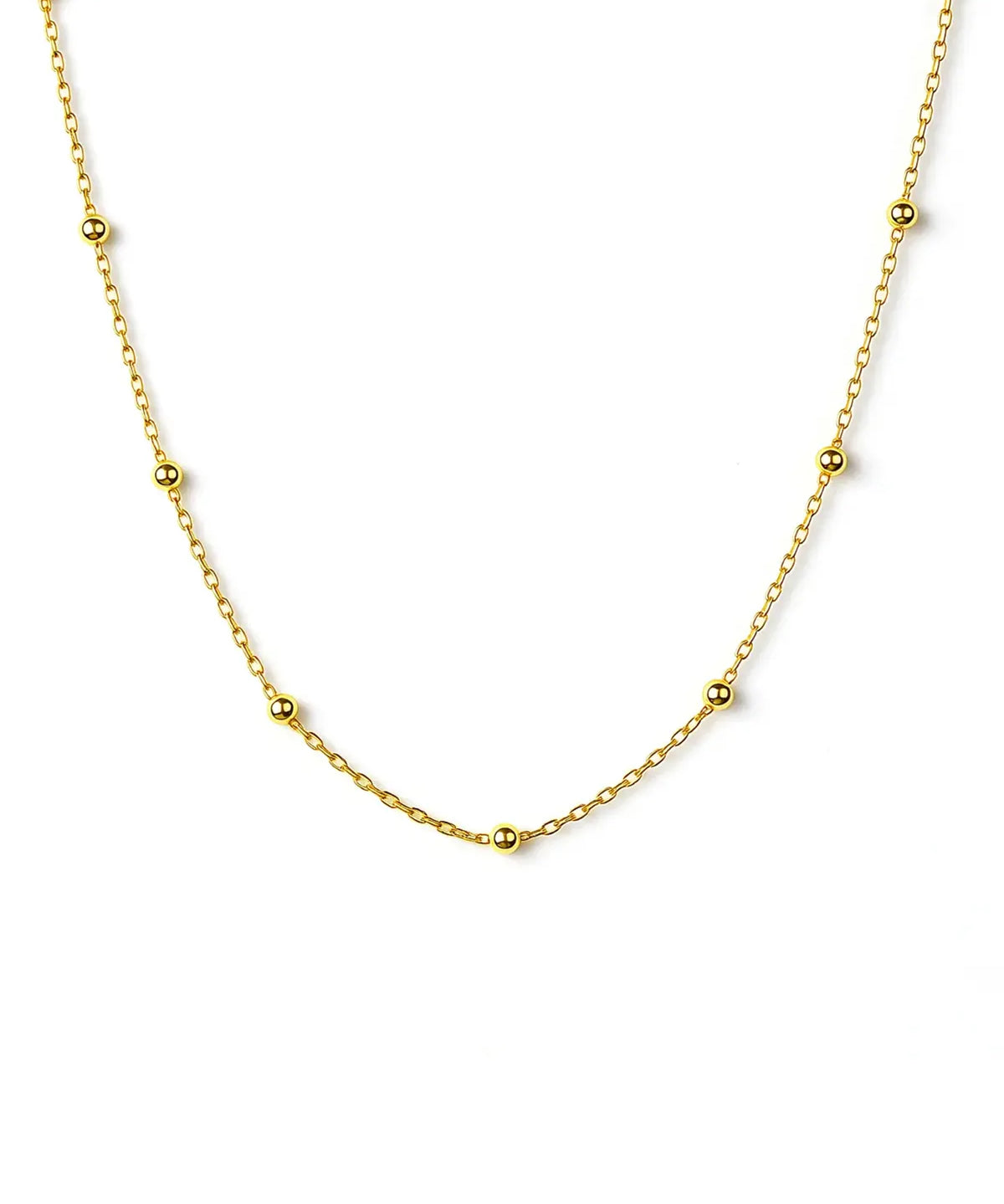 Gold chain necklace on a white background