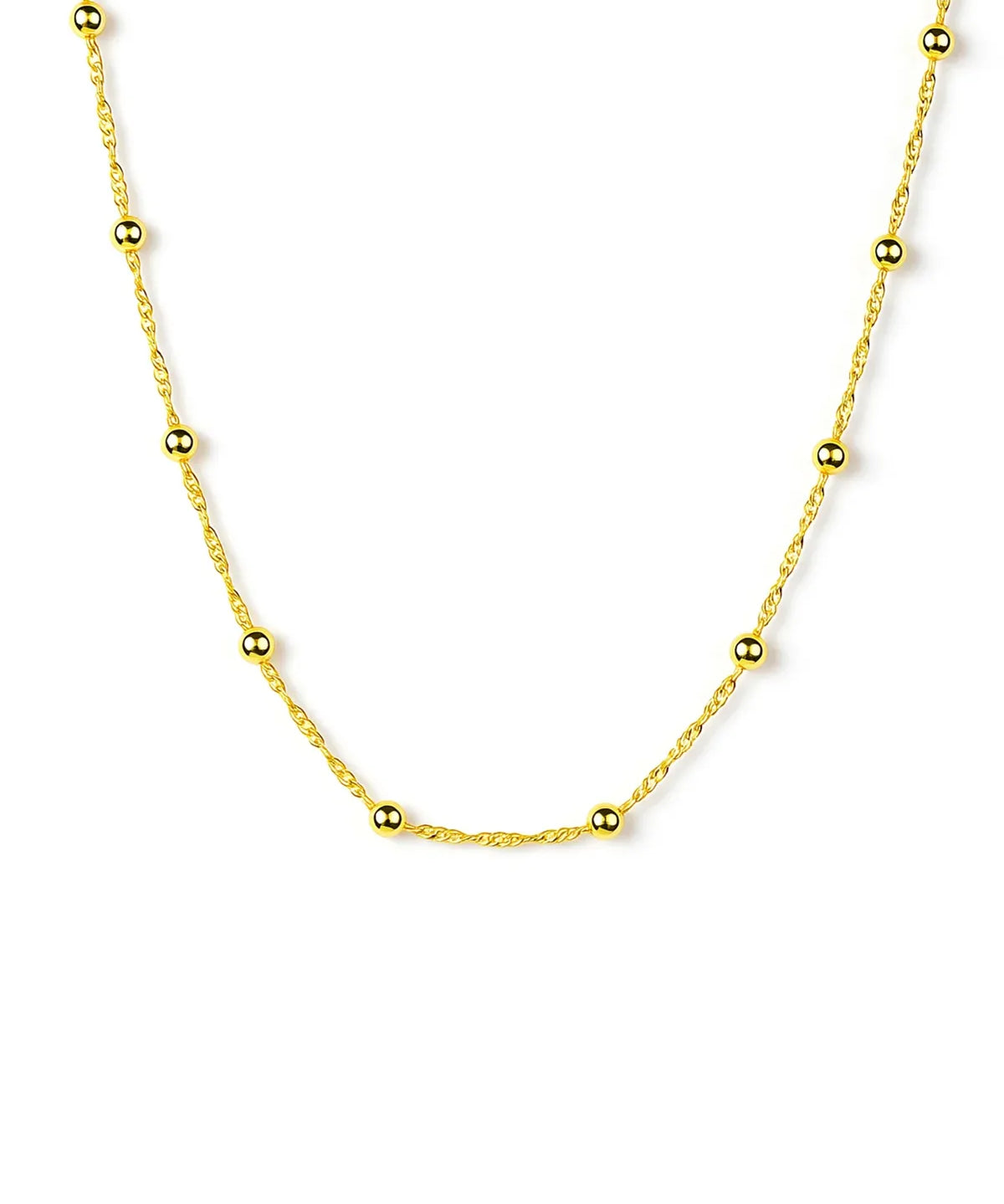Gold necklace with small beads on a white background