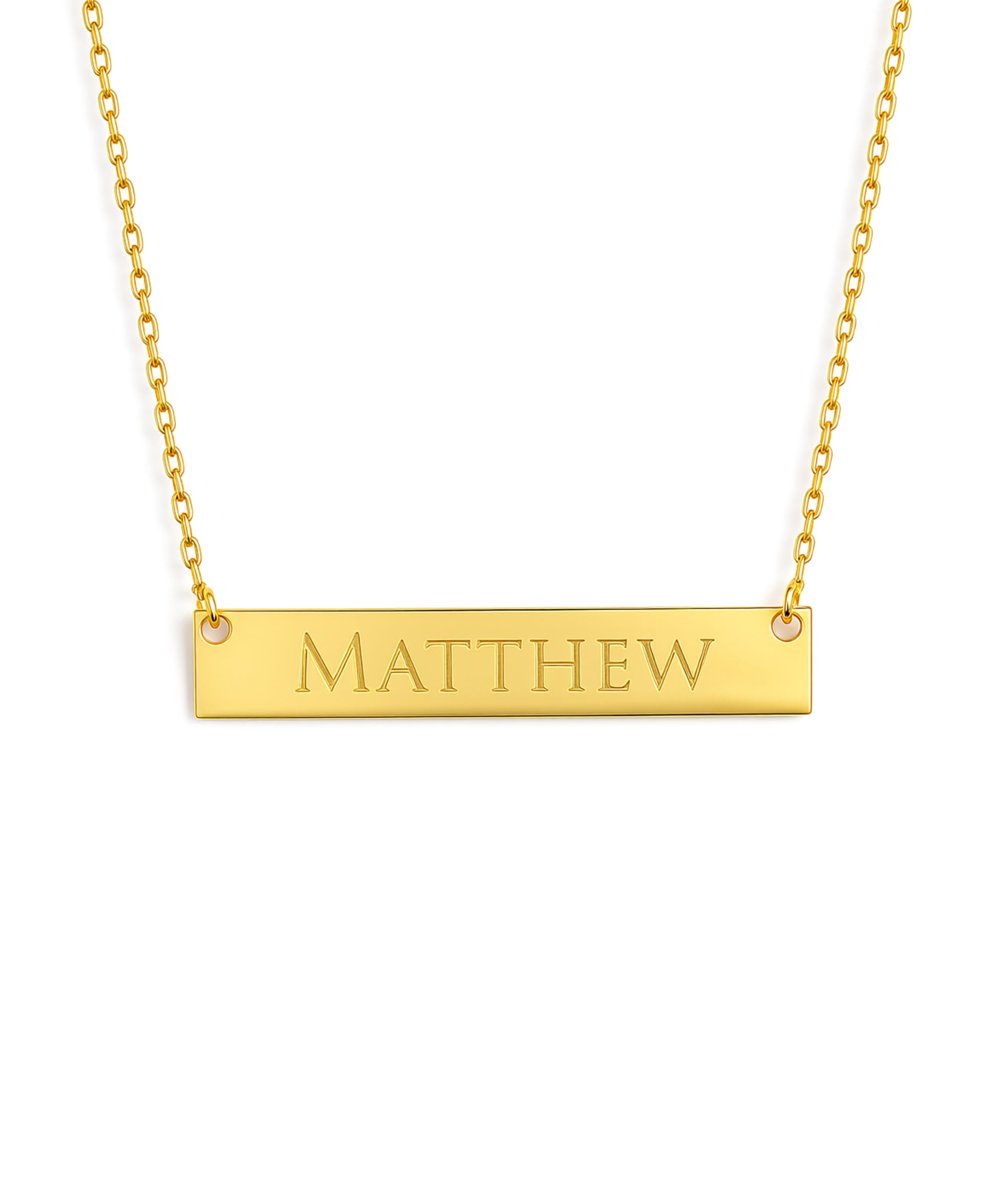Gold necklace with a bar pendant engraved with 'MATTHEW' on a white background
