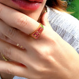 geometric ruby ring close shon on hand
