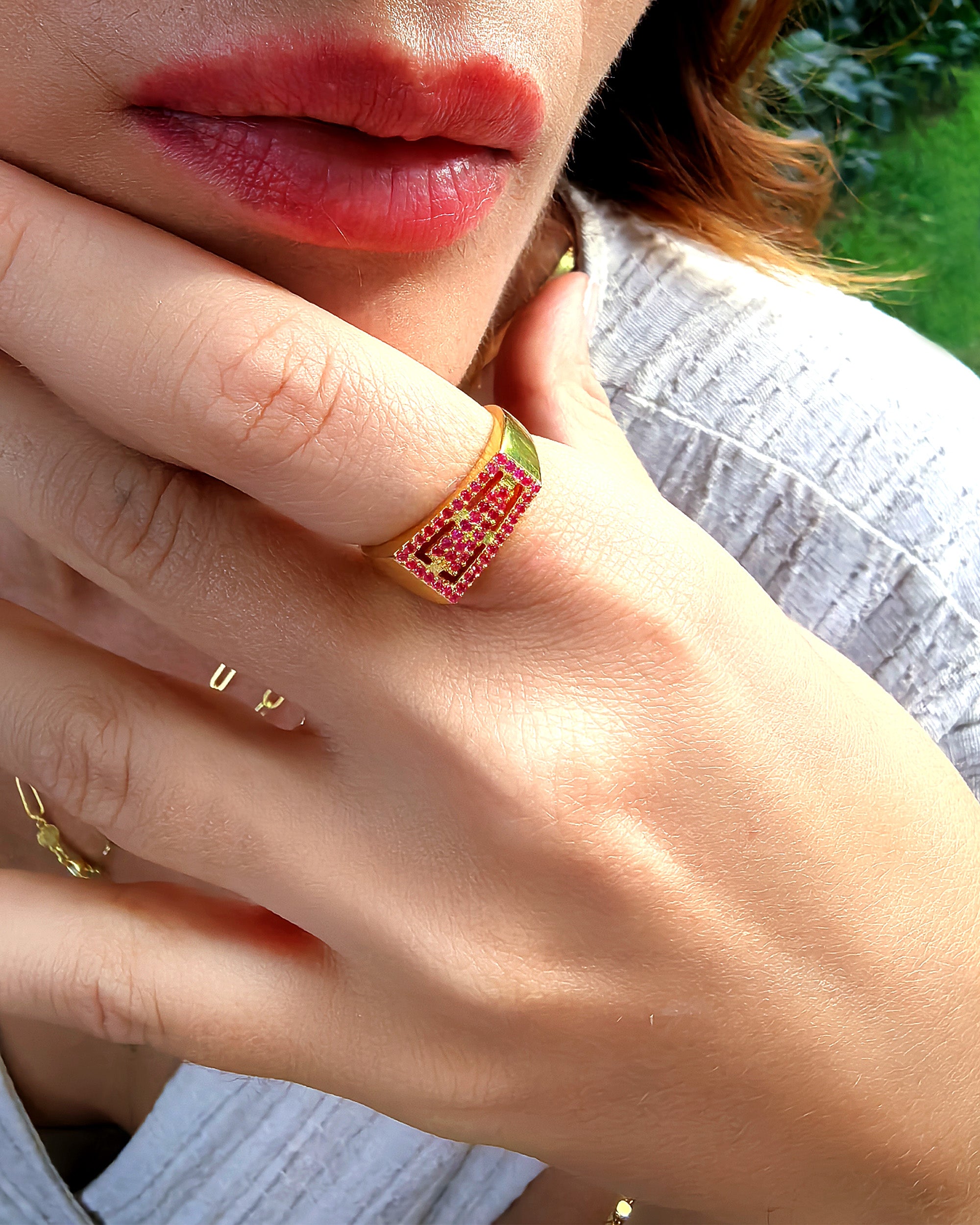 geometric ruby ring close shon on hand
