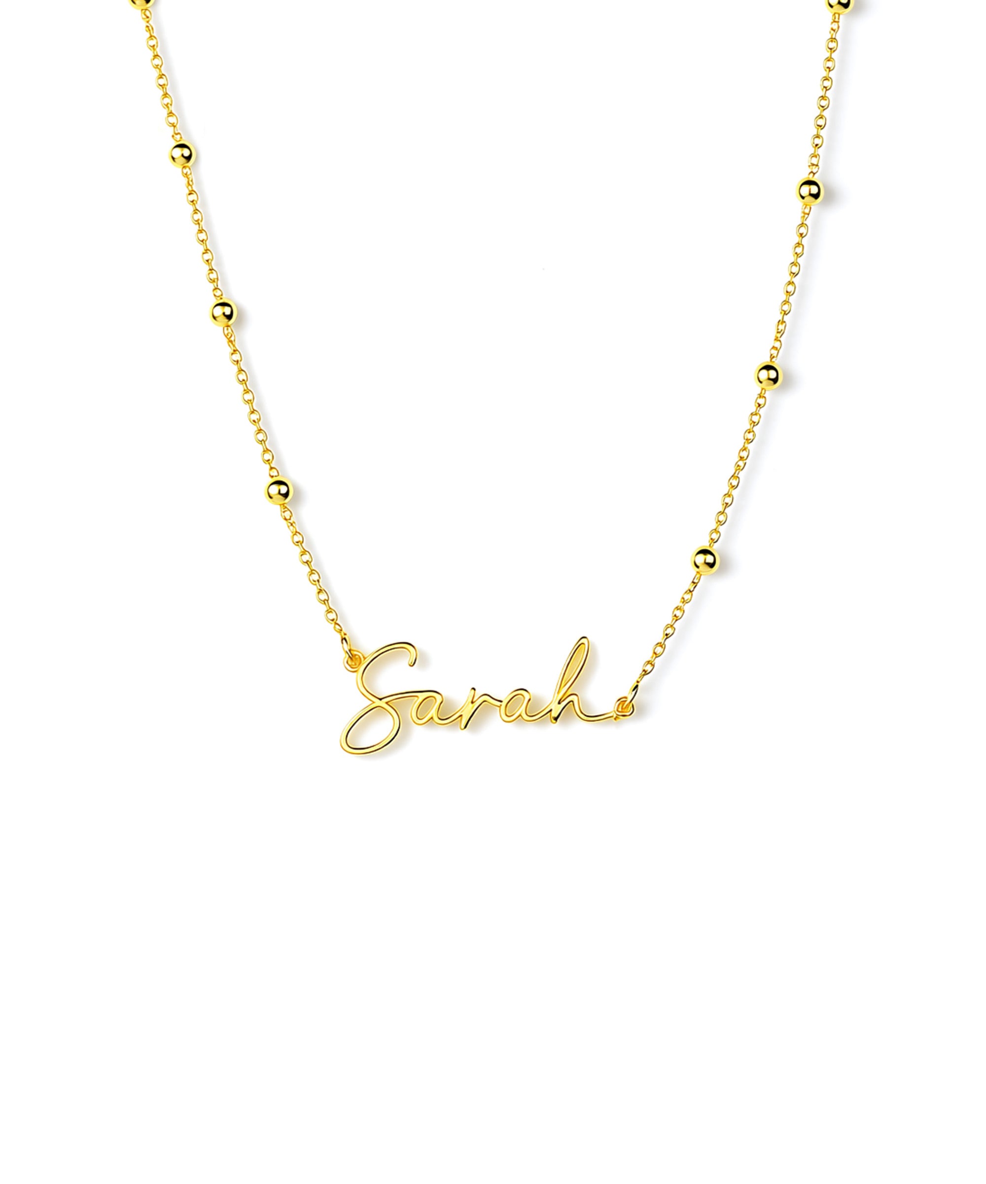 Gold necklace with 'Sarah' pendant on a white background