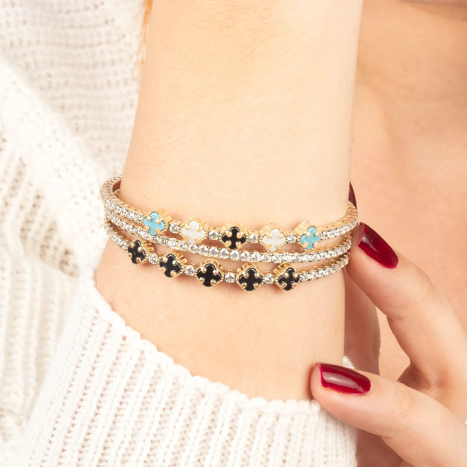 Stack of colorful beaded bracelets on a wrist.| MyJewelist